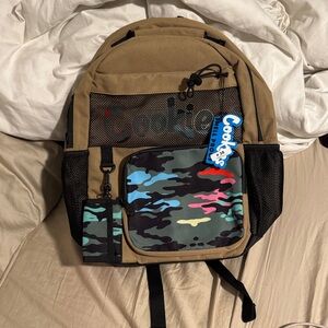 Tan Backpack with Multicolor Camo Front Pocket